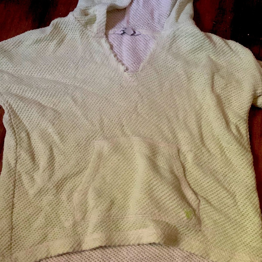 I am selling a light green breathable sweater with pockets